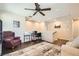 Open office space with comfortable seating, ceiling fan, and wood flooring at 7154 Brighton Village St, Las Vegas, NV 89166