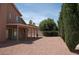 Spacious backyard featuring a covered patio with desert landscaping at 7720 Leavorite Dr, Las Vegas, NV 89128