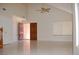 Bright living room featuring tile floors, vaulted ceilings and an open entry at 7720 Leavorite Dr, Las Vegas, NV 89128