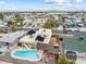 An elevated view of a home and pool with a surrounding cityscape and mountainous horizon at 816 Antigua St, Las Vegas, NV 89145