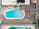 An aerial shot shows the backyard swimming pool with a slide, next to a covered patio at 816 Antigua St, Las Vegas, NV 89145