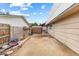 Sideyard features hardscape and side-yard access on a partially-fenced property at 816 Antigua St, Las Vegas, NV 89145