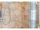 Close-up of the tiled shower with glass doors with dual shower heads and modern fixtures at 816 Antigua St, Las Vegas, NV 89145
