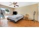 A bedroom with a sliding glass door with views of the pool, neutral colors, and tile floors at 816 Antigua St, Las Vegas, NV 89145