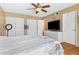 Cozy bedroom features neutral paint, large closet, and tile flooring, with a flat screen television at 816 Antigua St, Las Vegas, NV 89145