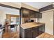 The kitchen flows into a dining area, revealing a fireplace and a glimpse of the pool at 816 Antigua St, Las Vegas, NV 89145