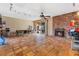An open living room with a brick fireplace, dining area, and sliding glass doors to the backyard at 816 Antigua St, Las Vegas, NV 89145