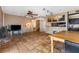 The living area includes tile floors, a brick fireplace, a tv, and a dining table at 816 Antigua St, Las Vegas, NV 89145