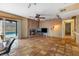 A spacious living room with tile floors and a fireplace with views of the outdoor pool at 816 Antigua St, Las Vegas, NV 89145