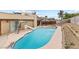 A private pool with slide, patio, and low maintenance landscaping is surrounded by fencing at 816 Antigua St, Las Vegas, NV 89145