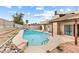 A private pool with a slide and tile accents, with a patio area and landscaping surrounding the pool at 816 Antigua St, Las Vegas, NV 89145