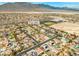 Drone shot of a residential area surrounded by desert, displaying community layout at 8220 Tursi Lodge Ct, Las Vegas, NV 89131