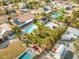 Expansive backyard retreat featuring a sparkling pool, lush landscaping, and solar panels at 8220 Tursi Lodge Ct, Las Vegas, NV 89131