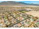 Aerial view of neighborhood showcasing home sites and surrounding desert landscape at 8220 Tursi Lodge Ct, Las Vegas, NV 89131