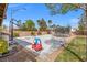 Playful backyard features a trampoline, playground, and basketball court at 8220 Tursi Lodge Ct, Las Vegas, NV 89131
