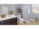 Well-lit bathroom featuring a single vanity, a walk-in shower, and modern fixtures at 8220 Tursi Lodge Ct, Las Vegas, NV 89131