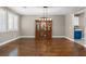 Elegant dining room boasting hardwood floors, a stylish china cabinet, and ample natural light at 8220 Tursi Lodge Ct, Las Vegas, NV 89131