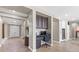 Inviting entryway showcasing tile floors, a home office nook, and a view through to the kitchen at 8220 Tursi Lodge Ct, Las Vegas, NV 89131