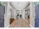 Bright foyer with tile flooring leading to living spaces, showcasing an open and inviting floor plan at 8220 Tursi Lodge Ct, Las Vegas, NV 89131