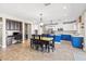 Spacious kitchen with an island, modern appliances, an adjacent dining area, and a built-in desk space at 8220 Tursi Lodge Ct, Las Vegas, NV 89131