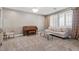 Cozy living room featuring neutral colors, plush carpet, shuttered windows, and comfortable seating at 8220 Tursi Lodge Ct, Las Vegas, NV 89131