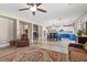 Expansive living space with a kitchen, dining area, a comfortable seating area, and tile flooring at 8220 Tursi Lodge Ct, Las Vegas, NV 89131
