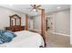 The main bedroom is furnished with a four-poster bed and elegant wooden furniture at 8220 Tursi Lodge Ct, Las Vegas, NV 89131