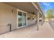 Extended patio area accessible through sliding glass doors offers seamless outdoor living space at 8220 Tursi Lodge Ct, Las Vegas, NV 89131