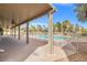 Spacious backyard patio overlooks pool area, offering an ideal transition from indoor to outdoor living at 8220 Tursi Lodge Ct, Las Vegas, NV 89131