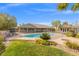 Backyard features a pool and yard area at 8220 Tursi Lodge Ct, Las Vegas, NV 89131