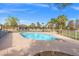 Backyard pool with diving board and desert landscaping at 8220 Tursi Lodge Ct, Las Vegas, NV 89131