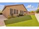 Backyard showcasing artificial turf, a landscaped yard with plants, offering a low-maintenance outdoor space at 8393 Canyon Crevasse St, Las Vegas, NV 89166