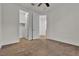 Empty bedroom featuring neutral walls and carpet; doors to closet and bathroom at 8393 Canyon Crevasse St, Las Vegas, NV 89166