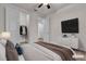 Staged bedroom with television, dresser, and direct access to closet at 8393 Canyon Crevasse St, Las Vegas, NV 89166