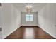 Bright bedroom with hardwood floors and a modern chandelier at 8393 Canyon Crevasse St, Las Vegas, NV 89166