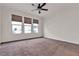 Large bedroom featuring neutral carpet, crown molding, and plentiful natural light at 8393 Canyon Crevasse St, Las Vegas, NV 89166