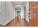 Open foyer with hardwood floors, arched doorways, and a glimpse of the bright, airy interior at 8393 Canyon Crevasse St, Las Vegas, NV 89166