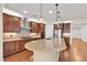 Stylish kitchen featuring a granite island, modern appliances, and sleek wood cabinets at 8393 Canyon Crevasse St, Las Vegas, NV 89166