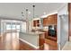 Bright kitchen featuring an island, stainless appliances, and a view into the living area at 8393 Canyon Crevasse St, Las Vegas, NV 89166