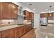 Updated kitchen with a large island, stainless steel appliances, and tile backsplash at 8393 Canyon Crevasse St, Las Vegas, NV 89166