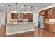 Modern kitchen with a large island, stainless steel appliances, and warm wood cabinetry at 8393 Canyon Crevasse St, Las Vegas, NV 89166