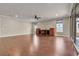 Spacious living room features hardwood floors, ceiling fan, and custom built-ins at 8393 Canyon Crevasse St, Las Vegas, NV 89166