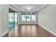 Bright, open living area with hardwood floors and sliding glass doors at 8393 Canyon Crevasse St, Las Vegas, NV 89166