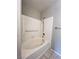 Bathroom featuring a tiled bathtub and shower with a support handle at 8501 W University Ave # 1128, Las Vegas, NV 89147