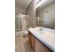 Bathroom featuring a single sink vanity with tiled countertop and a shower-tub combination at 8501 W University Ave # 1128, Las Vegas, NV 89147