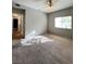 Sunlit bedroom with neutral walls and plush carpet at 8501 W University Ave # 1128, Las Vegas, NV 89147