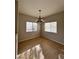 Cozy dining room featuring hardwood floors and a charming chandelier fixture at 8501 W University Ave # 1128, Las Vegas, NV 89147