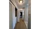 Well lit hallway showing the entrance to the laundry closet at 8501 W University Ave # 1128, Las Vegas, NV 89147