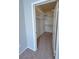Spacious walk-in closet with ample shelving and carpet flooring at 8501 W University Ave # 1128, Las Vegas, NV 89147