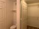 Full bathroom with white fixtures and a shelved closet space at 8555 W Russell Rd # 1078, Las Vegas, NV 89113